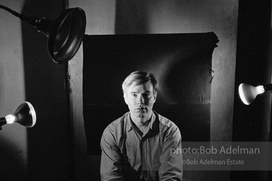 Andy Warhol photographed using his portrait lighting and background cloth at the Factory. 1965.