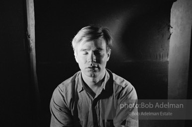 Andy Warhol photographed using his portrait lighting and background cloth at the Factory. 1965.