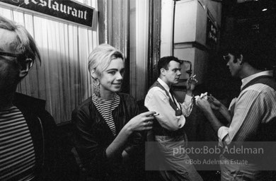 Andy Warhol and  entourage late at night outside a NYC night club, 1865