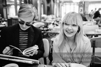 Andy Warhol and Bibbe Hanson at a mid-town restaurant, New York City, 1965.