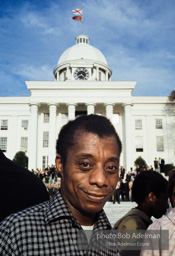 Jimmy Baldwin in front of the cradle of the Confederacy, Montgomery, Alabama, 1965