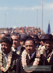 Martin Luther King crossing the Edmund Pettus bridge at the beginning of the Selma to Montgomery march, Selma Alabama, 1965.